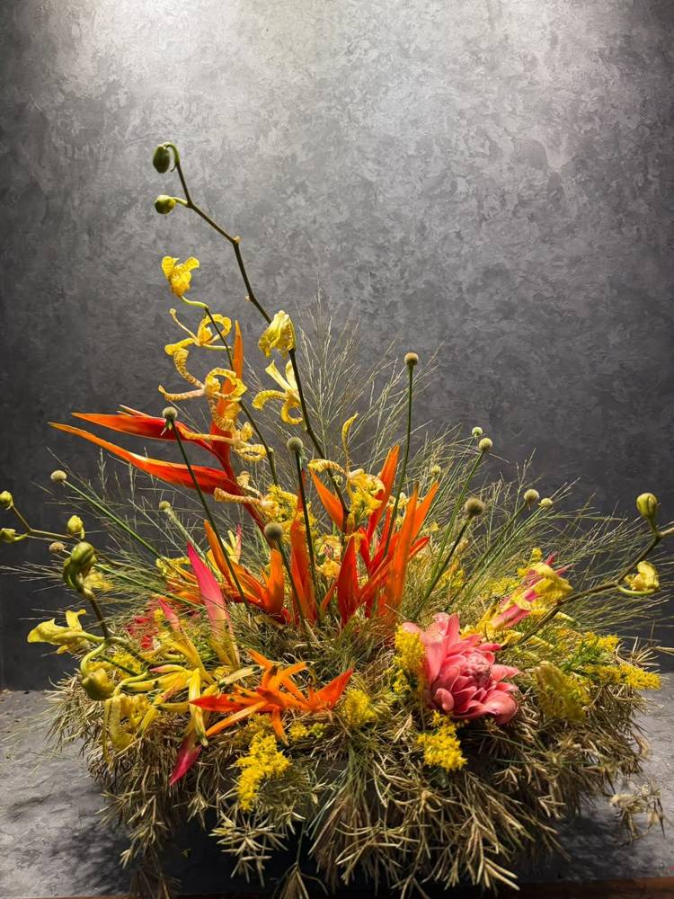 Heliconia with blue-painted sculptural stems and white anthurium